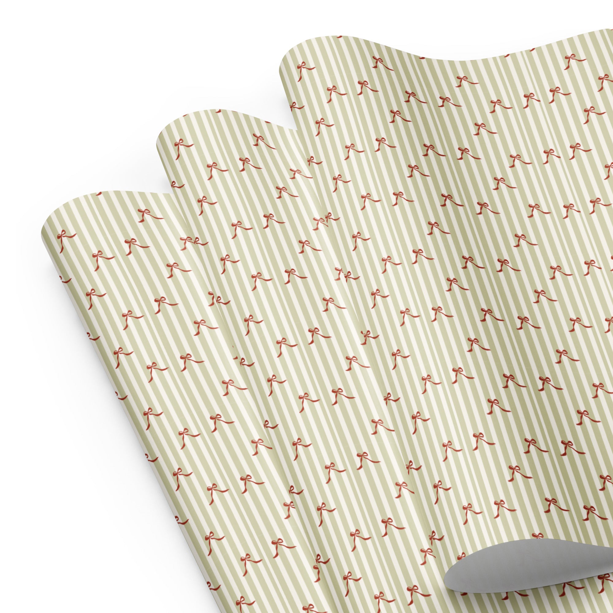 Two green placemats with red pattern on a white background