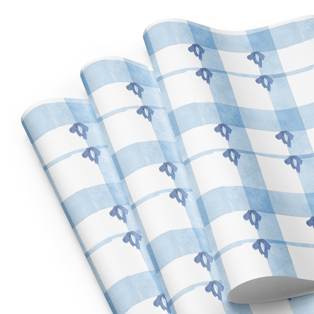Roll of blue and white checkered paper with decorative elements on a white background