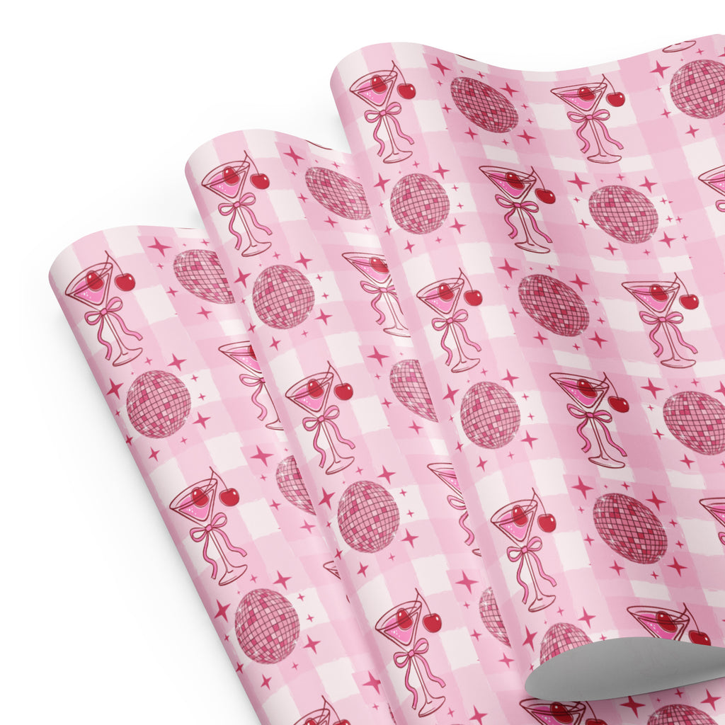 Pink patterned paper with cocktail-themed design on a white background