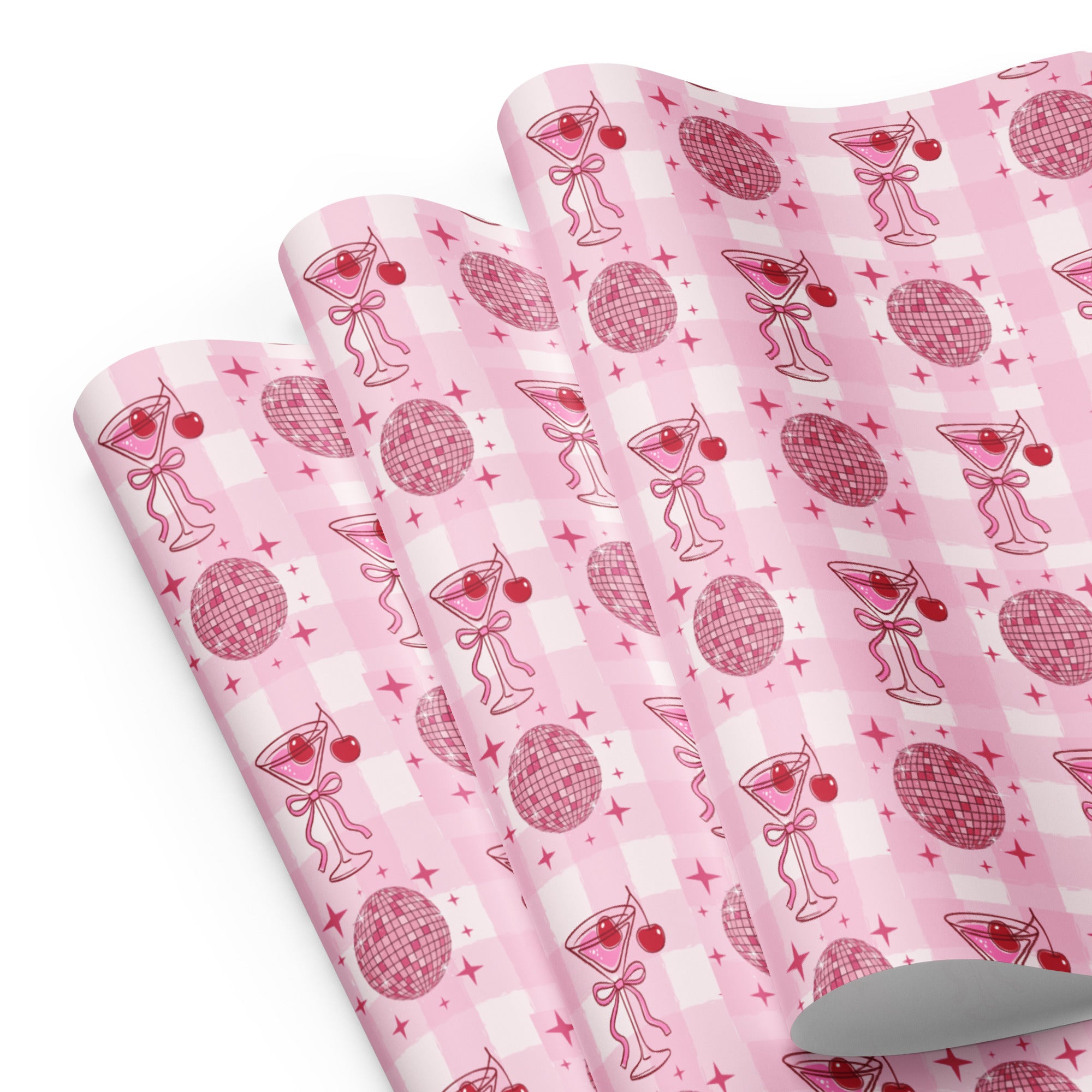 Pink patterned paper with cocktail-themed design on a white background
