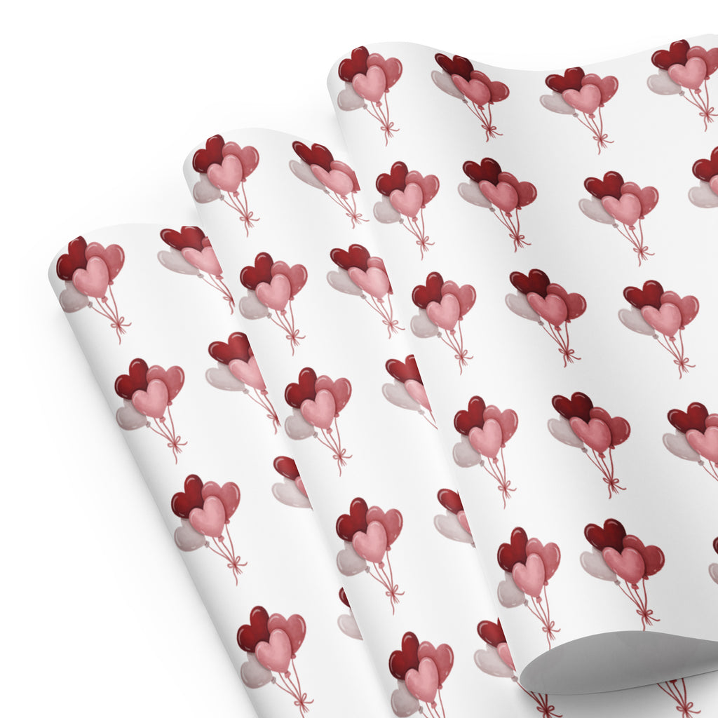 Wrinkled wrapping paper with balloon pattern on a white background
